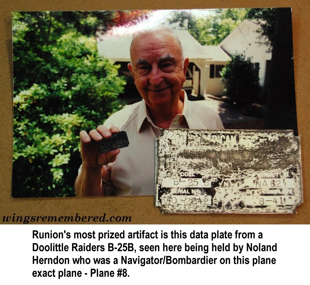 Noland Herndon holding data plate from plane caption